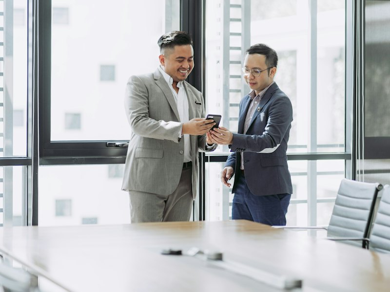 Two professionals meeting in a boardroom
